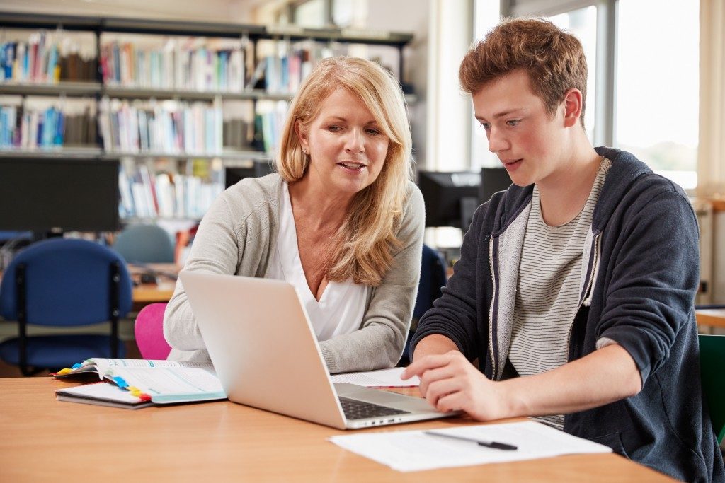 Female high school teacher and her student