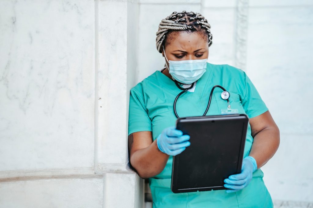 nurse using her iPad