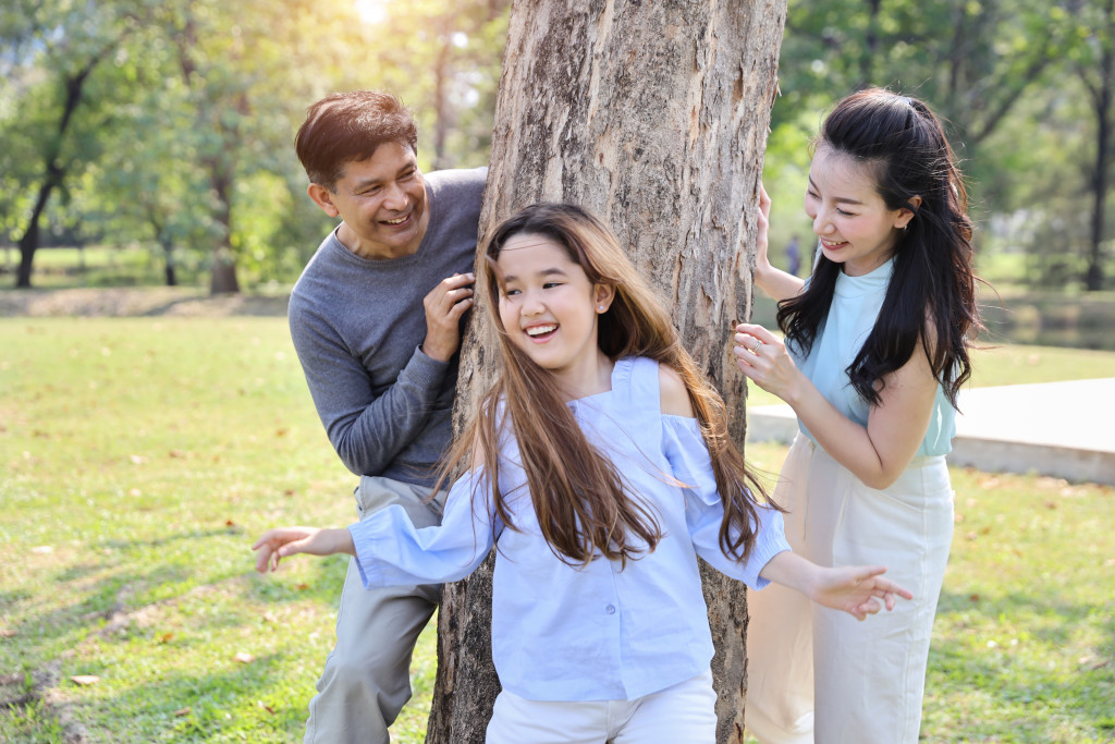 A family playing tag outdoors