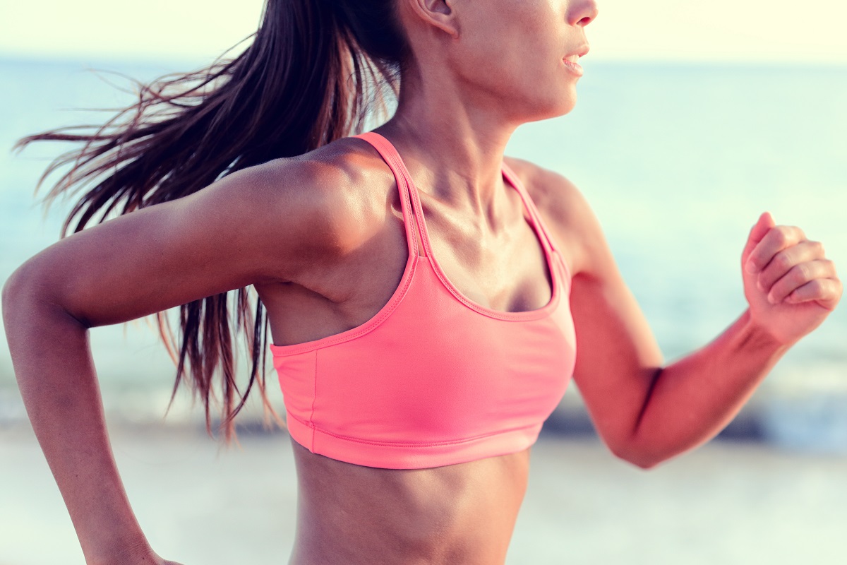 A woman jogging by the beach